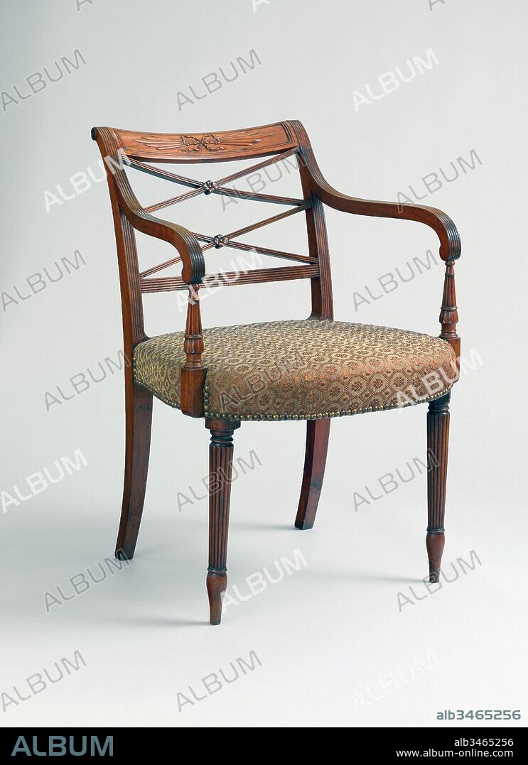 Armchair, ca. 1810, Made in New York, New York, United States, American, Mahogany, 32 7/8 x 22 1/8 x 19 in. (83.5 x 56.2 x 48.3 cm), Furniture, Charles-Honoré Lannuier (France 1779–1819 New York), This unusually wide scroll-back armchair is in the style of Duncan Phyfe (1768–1854) but bears a fragment of the bilingual printed label of the French-émigré cabinetmaker Charles- Honoré Lannuier. It is the only scroll-back chair among the many known New York examples that is documented to a specific shop by a label or signature.