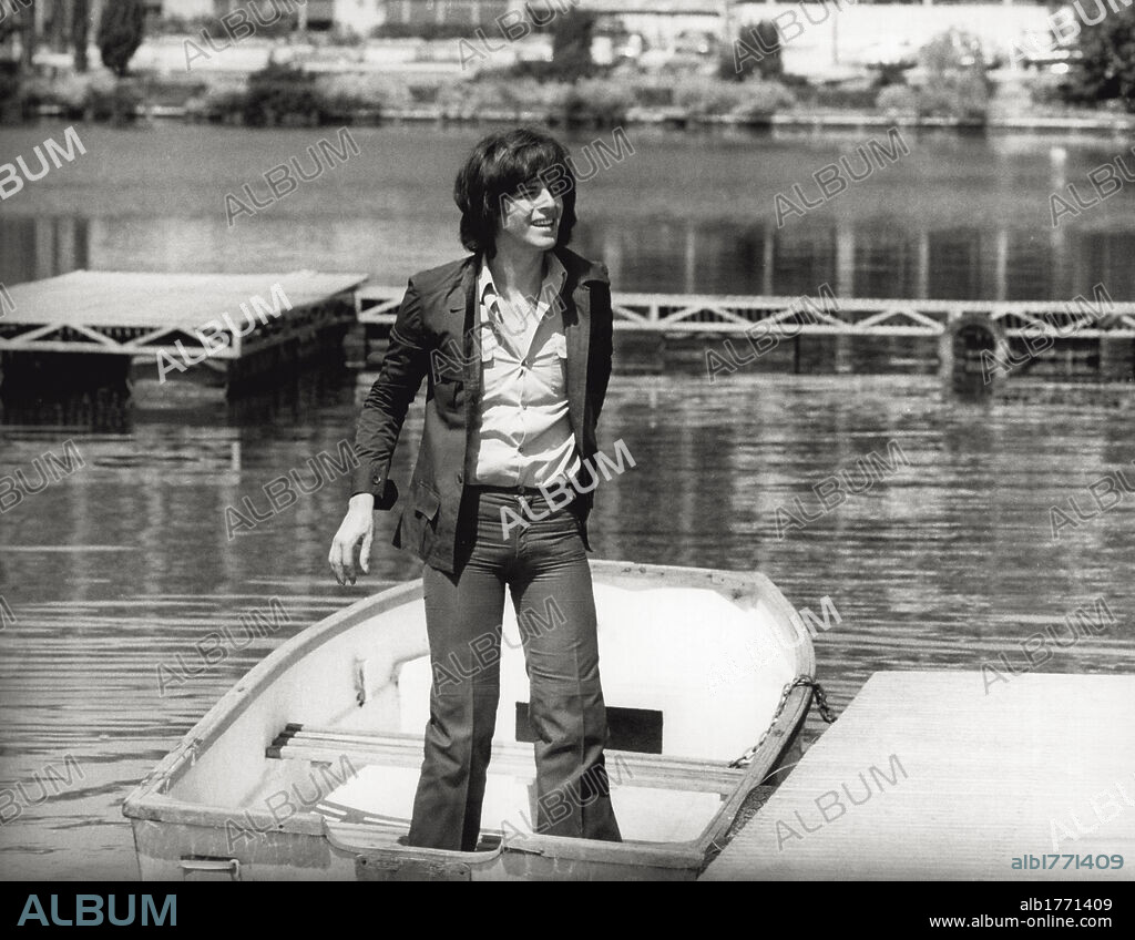 Claudio Baglioni. Claudio Baglioni poses standingon a boat; the singer-songwriter of Rome has success in 1972 with the song 'Questo piccolo grande amore'. Rome, 1974.