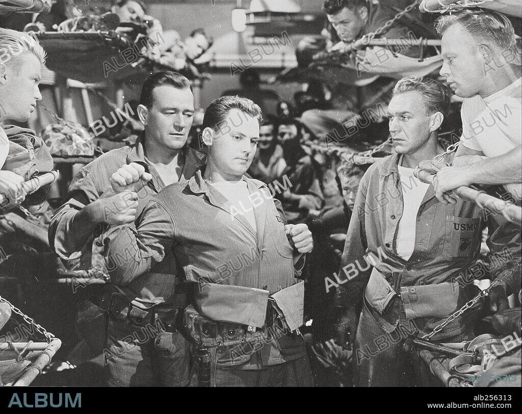 JOHN AGAR and JOHN WAYNE in SANDS OF IWO JIMA, 1949, directed by ALLAN DWAN. Copyright REPUBLIC PICTURES.