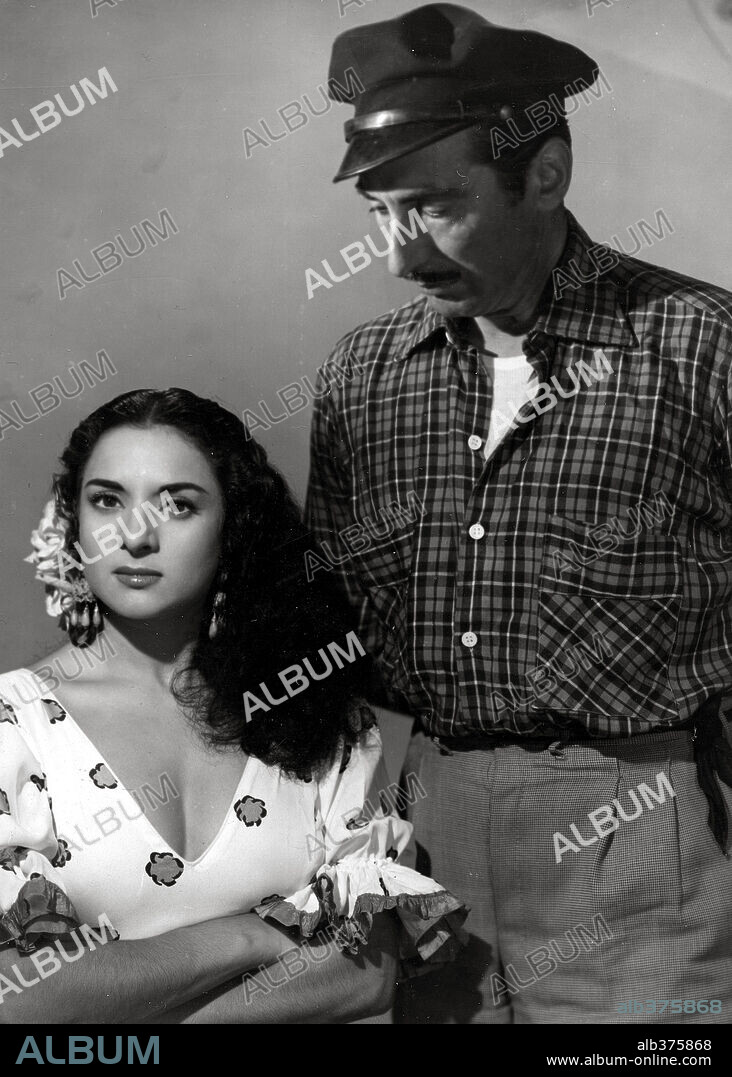 JOSE NIETO and LOLA FLORES in LA ESTRELLA DE SIERRA MORENA, 1952, directed by RAMON TORRADO. Copyright SUEVIA FILMS.