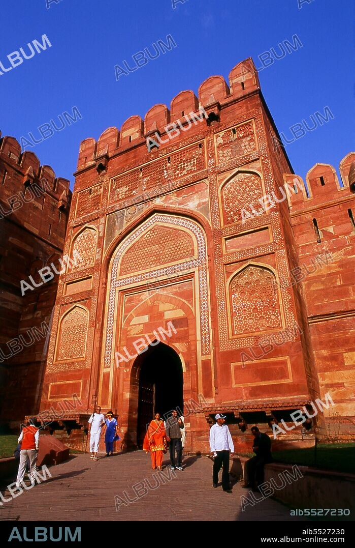 Agra Fort was originally a brick fort, held by the Hindu Sikarwar Rajputs. It was mentioned for the first time in 1080 CE when a Ghaznavide force captured it. Sikandar Lodi (1488–1517) was the first Sultan of Delhi who shifted to Agra and lived in the fort. He governed the country from here and Agra assumed the importance of the second capital. After the First Battle of Panipat in 1526, Mughals captured the fort. The victorious Babur stayed in the fort in the palace of Ibrahim and built a baoli (step well) in it. The emperor Humayun was crowned here in 1530. Humayun was defeated at Bilgram in 1540 by Sher Shah Suri. The fort remained with Suris till 1555, when Humayun recaptured it. The Hindu king Hem Chandra Vikramaditya, also called 'Hemu', defeated Humayun's army, led by Iskandar Khan Uzbek, and won Agra. Hemu got a huge booty from this fort and went on to capture Delhi from the Mughals. The Mughals under Akbar defeated King Hemu finally at the Second Battle of Panipat in 1556. Realizing the importance of its central situation, Akbar made it his capital and arrived in Agra in 1558. The fort was in a ruined condition and Akbar had it rebuilt with red sandstone, completing it in 1573. It was only during the reign of Akbar's grandson, Shah Jahan, that the site took on its current state.