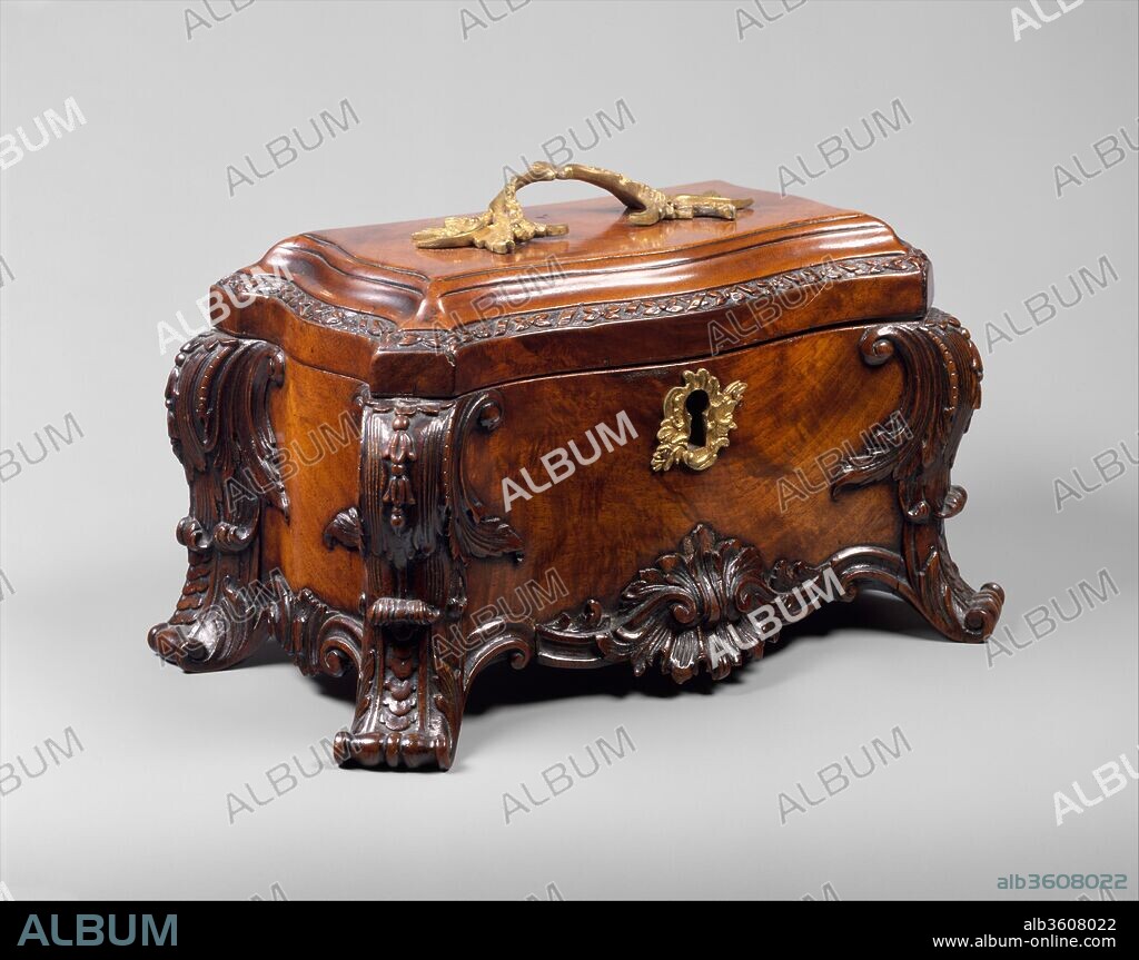 Tea chest. Culture: British. Dimensions: Overall: 6 × 11 1/2 × 6 1/2 in. (15.2 × 29.2 × 16.5 cm). Date: ca. 1760.
The English satirist Jonathan Swift (1667-1745) wrote in his Directions to Servants (1729) about "small chests and trunks with lock and key, wherein they keep the tea and sugar." Executed in a late Rococo style, this example, with its serpentine sides, scroll feet, and crisp carving on front and sides, displays some similarities to designs in the first and third editions of Thomas Chippendale's Gentleman and Cabinetmaker's Director (1754, 1762).