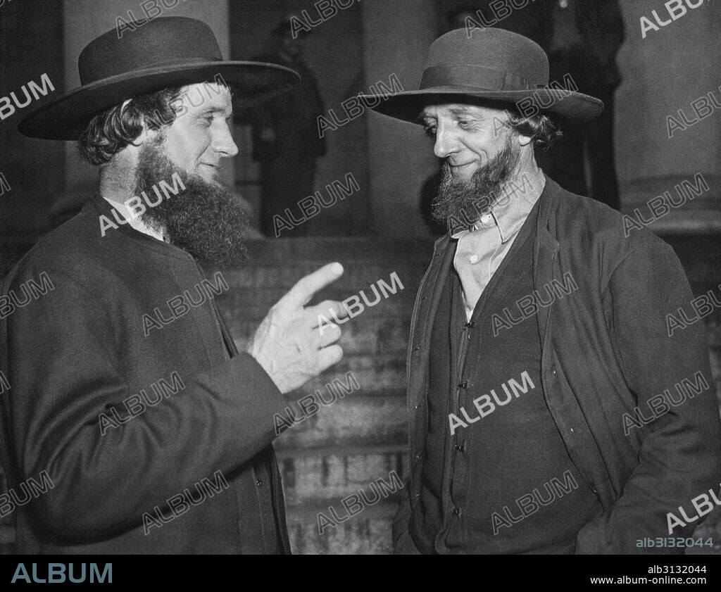 Washington, D.C.:  c. 1934 Two Amish men in Washington D.C. to protest the Public Works Administration {PWA}  grant to build schoools in their district as it would violate tenets of their sect that forbids acceptance of loans and it would also require students to ride in buses to reach the schools, another departure from their way of only using horse drawn carriages for transportation.