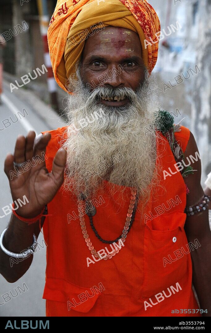 Indian sadhu waving in Vrindavan, Uttar Pradesh. India.