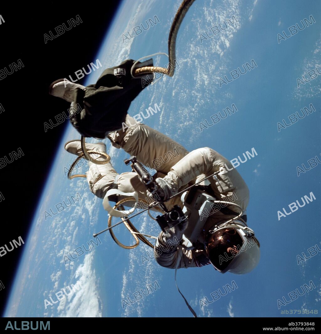 Astronaut Edward H. White II, pilot of the Gemini IV four day Earth-orbital mission, floats in the zero gravity of space outside the Gemini IV spacecraft. White wears a specially designed spacesuit; and the visor of the helmet is gold plated to protect him against the unfiltered rays of the sun. He wears an emergency oxygen pack, also. He is secured to the spacecraft by a 25 feet umbilical line and a 23 feet tether line, both wrapped in gold tape to form one cord. In his right hand is a Hand-Held Self-Maneuvering Unit (HHSMU) with which he controls his movements in space. Astronaut James A. McDivitt, command pilot of the mission, remained inside the spacecraft.