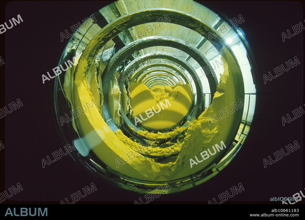 Yellow cake powdery uranium oxide in a Burwell filter press contains 75% uranium. U3O8 is not harmfully radioactive yet. Uranium City, Saskatchewan, Canada.
