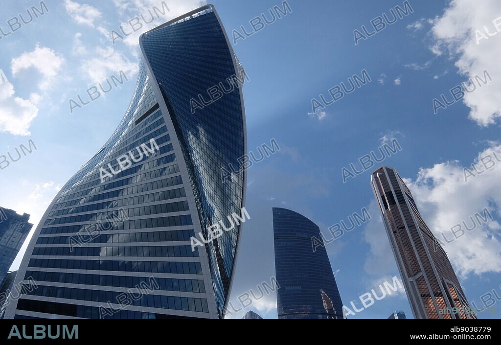 The Evolution Tower skyscraper, located in the Moscow International Business Center in Moscow, Russia. The 55-story office building has a height of 246 metres (807 ft) and a total area of 169,000 square metres (1,820,000 sq ft). Noted in Moscow for its futuristic DNA-like shape, the building was designed by British architect Tony Kettle in collaboration with University of Edinburgh's Professor of Art Karen Forbes. Construction of the tower began in 2011 and completed in late 2014.