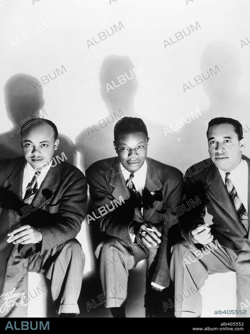 NAT KING COLE. The original trio, Wesley Prince (bass), Nat 'King' Cole (piano, vocals) and Oscar Moore (guitar). 1940