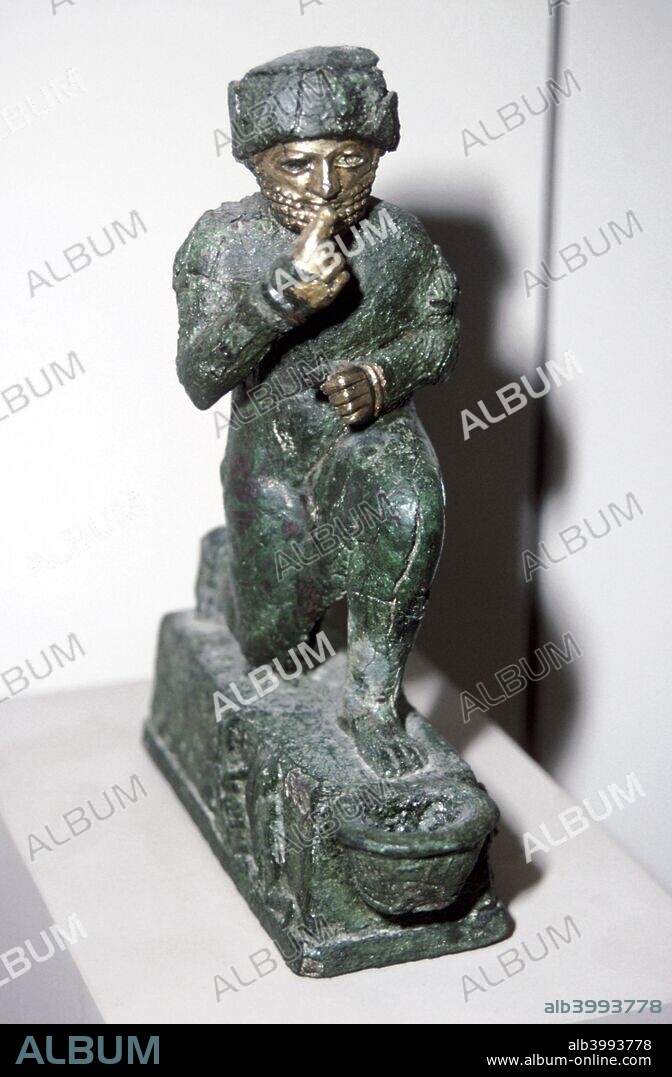 Bronze figurine of a kneeling worshipper, Larsa, 2nd millenium BC. From the collection at The Louvre.
