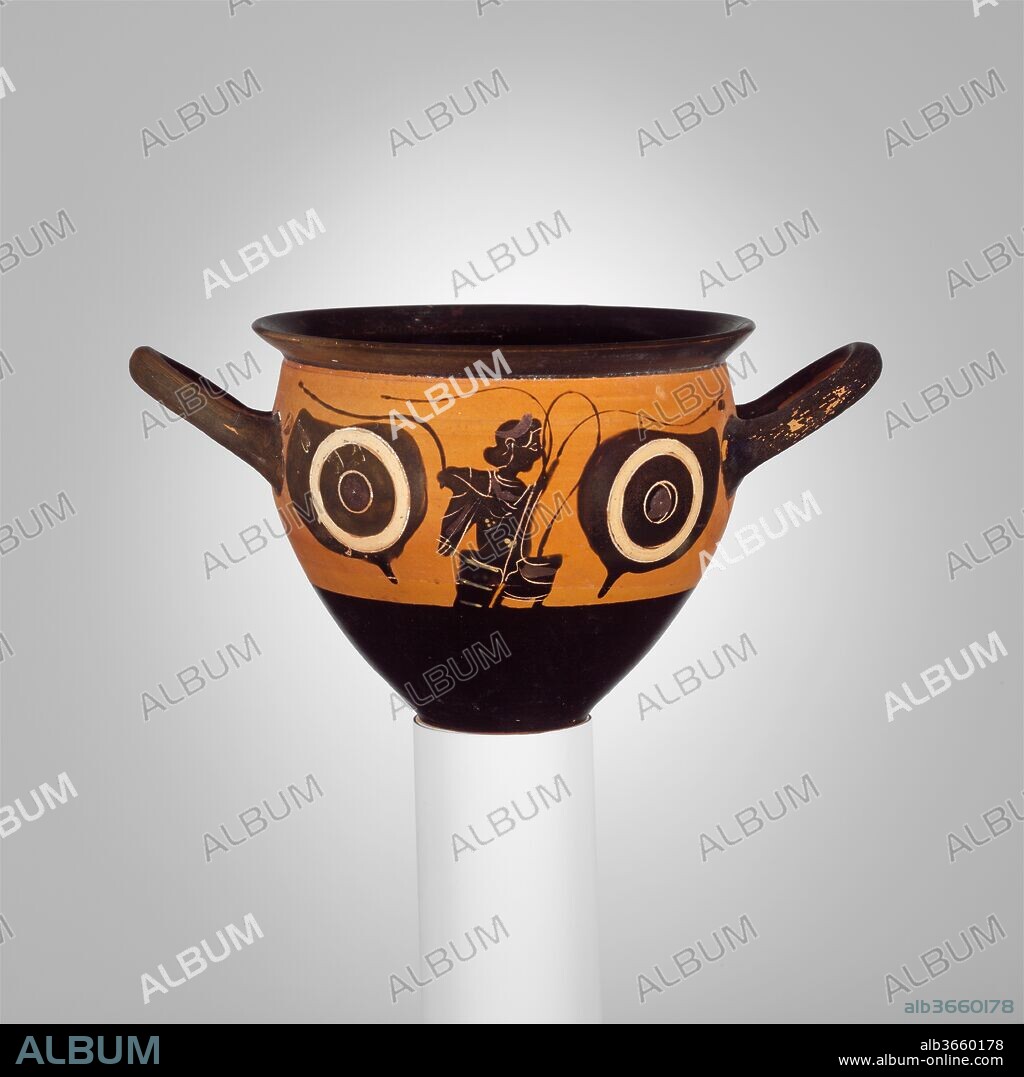 Terracotta mastoid (drinking cup with narrow base). Culture: Greek, Attic. Dimensions: H. 3 1/4 in. (8.3 cm); diameter  4 1/8 in. (10.5 cm); width with handles  6 1/8 in. (15.6 cm). Date: ca. 500 B.C..
Obverse, between eyes, seated youth with branches
Reverse, between eyes, nose
The mastoid is a variant of the skyphos characterized by the breast-like shape, which provides its name. The eyes on either side reflect a predilection in Attic vase-painting between about 540 and 500 B.C. While their meaning has not been conclusively established, they certainly have to do with the insights afforded by the consumption of wine and its perils. Mastoids are among the vases for drinking imported into Etruria in large numbers.
