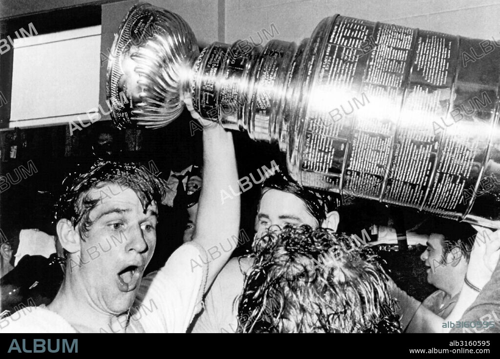 Boston, Massachusetts: May 10, 1970 Boston Bruins star Bobby Orr whoops and holds up the Stanley Cup after he scored the winning goal in overtime against the St. Louis Blues at the Boston Garden. Boston won the hockey playoff championship for the first time in 29 years.