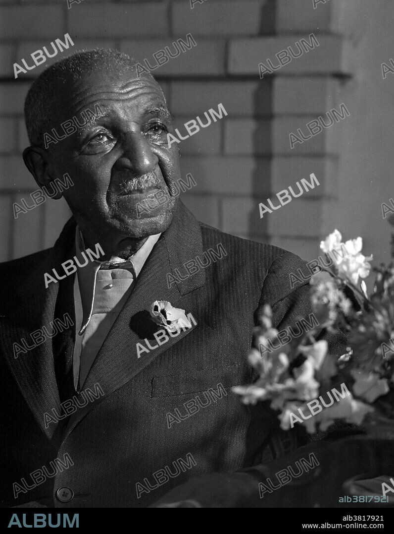 George Washington Carver (1864 - January 5, 1943) was an African-American scientist, botanist, educator, and inventor born into slavery. In 1891 he attended and studied botany at Iowa State Agricultural College where he was the first black student, and later taught as the first black faculty member. His reputation is based on his research into and promotion of alternative crops to cotton, such as peanuts, soybeans and sweet potatoes, which also aided nutrition for farm families. He wanted poor farmers to grow alternative crops both as a source of their own food and as a source of other products to improve their quality of life. As an agricultural chemist, Carver discovered three hundred uses for peanuts and hundreds more for soybeans, pecans and sweet potatoes. He died in 1943, at the age of 78. In 1977, he was elected to the Hall of Fame for Great Americans. In 1990, he was inducted into the National Inventors Hall of Fame. Carver is often referred to as "Father of Chemurgy". Photographed by Arthur Rothstein, 1942.
