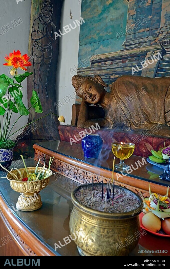 Reclining Buddha statue on an altar in a prayer room of the Brahma Vihara Buddhist monastery, Banjar, North Bali, Bali, Indonesia, Asia.