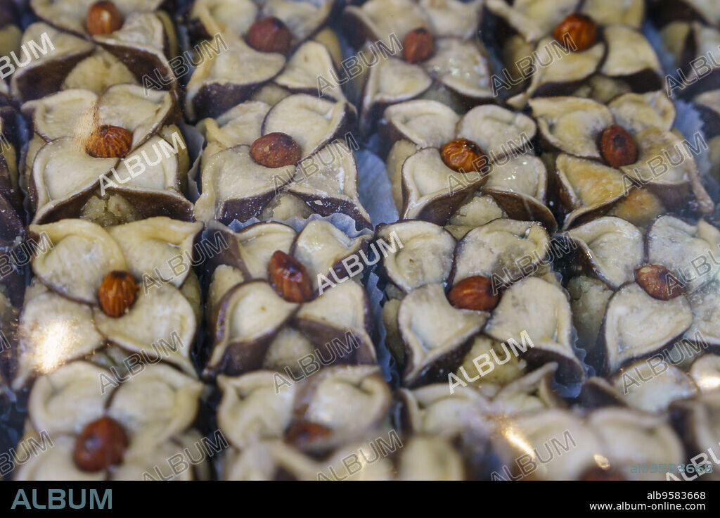 Moroccan sweet makhroud, puff pastry baklava with flower-shaped almonds, Talaa Kebira , Fès el-Bali, Fez, morocco, africa.