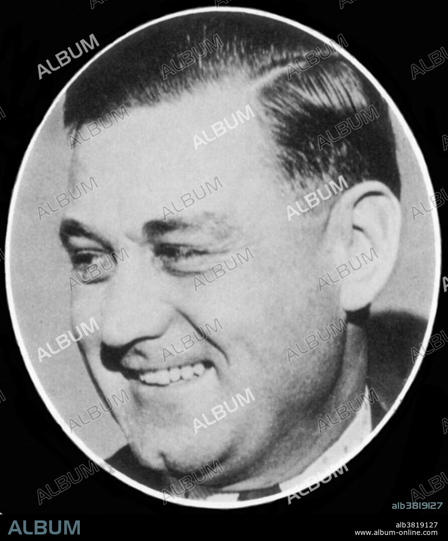 Adelard Cunin (August 21, 1893 - February 25, 1957), better known as George "Bugs" Moran, was an American mobster. He was incarcerated three times before turning 21. Prohibition was established in 1920 which banned the distribution of alcoholic beverages. Subsequently, criminal enterprises sprang up to smuggle liquor. Moran was part of the O'Banion mob, known as the North Side Gang. Moran's bootlegging operation posed a threat to Capone's South Side Gang. The rivals fought violently resulting in what is known as, "The Bootleg Battle of the Marne" and culminated in the Saint Valentine's Day Massacre. After losing power he reverted to committing common crimes like mail fraud and robbery. By the 1940s, only 17 years after being one of the richest gangsters in Chicago, Moran was almost penniless. He was tried for robbery in 1957, found guilty and sentenced to 10 years in prison. He died of lung cancer in 1957 at age 63. No photographer credited, undated.