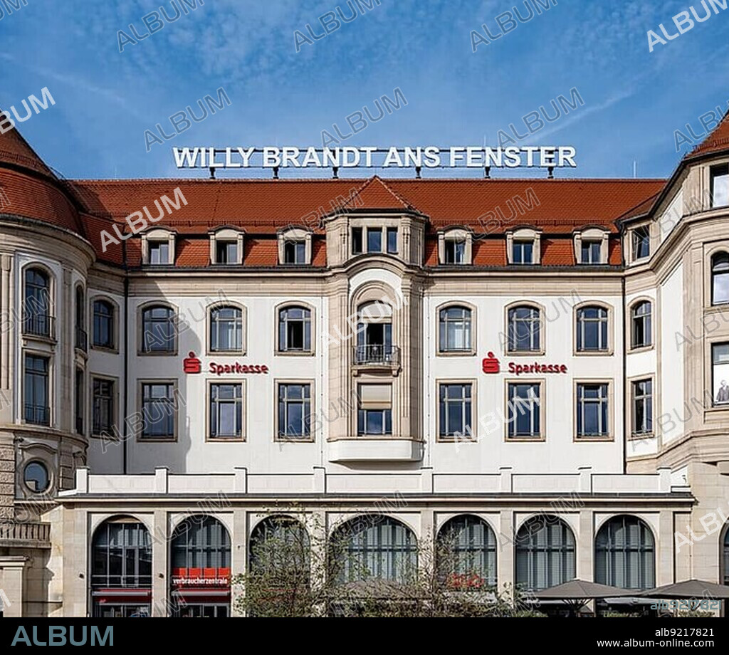 The inscription Willy Brandt ans Fenster on the former Interhotel Erfurter Hof and a photo of Willy Brandt in the window of the building on Willy-Brandt-Platz opposite Erfurt's main railway station commemorate the visit of the then German Chancellor Willy Brandt on 19 March 1970, who showed himself at the hotel's window after thousands of GDR citizens shouted: Willy Brandt at the window, Erfurt, Thuringia, Germany, Europe.