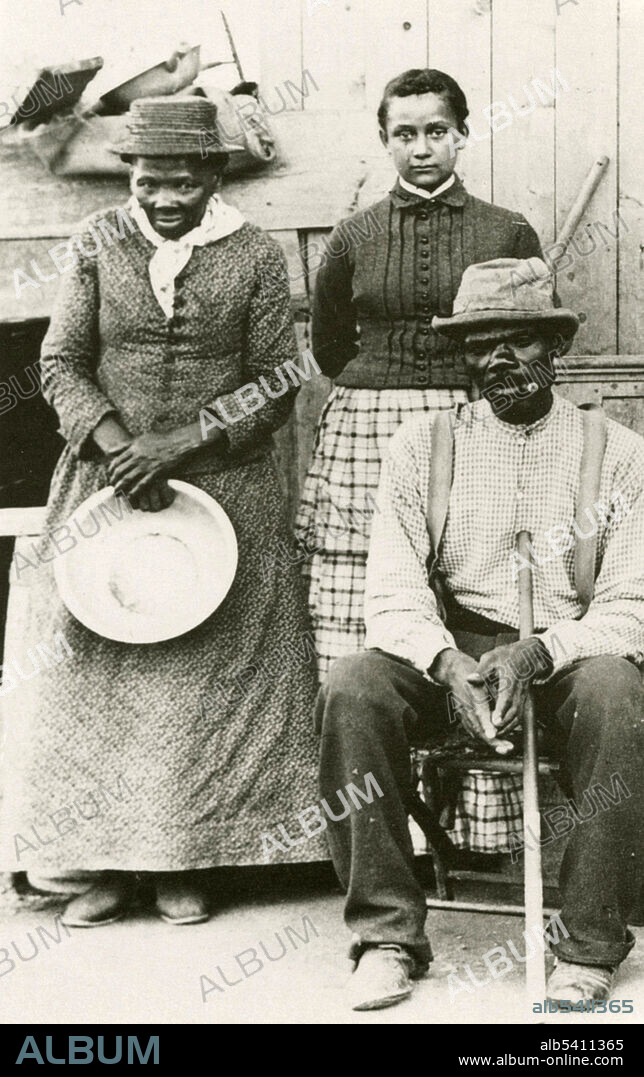 Harriet Tubman, her husband Nelson Davis, and their adopted daughter Gertie, c. 1887. Tubman stands on the left holding a pan. Harriet Tubman (1822-1913) was an American abolitionist and political activist. Born a slave in Maryland, Tubman escaped to Philadelphia, then immediately returned to Maryland to rescue her family. She made some 13 missions to rescue about 70 people, family and friends, using the Underground Railroad. Tubman met the abolitionist John Brown in 1858, and helped him plan and recruit supporters for the raid on Harpers Ferry. When the Civil War began, Tubman worked for the Union Army, first as a cook and nurse, and then as an armed scout and spy. The first woman to lead an armed expedition in the war, she guided the raid at Combahee Ferry, which liberated more than 700 slaves.  Photograph by William Haight Cheney.