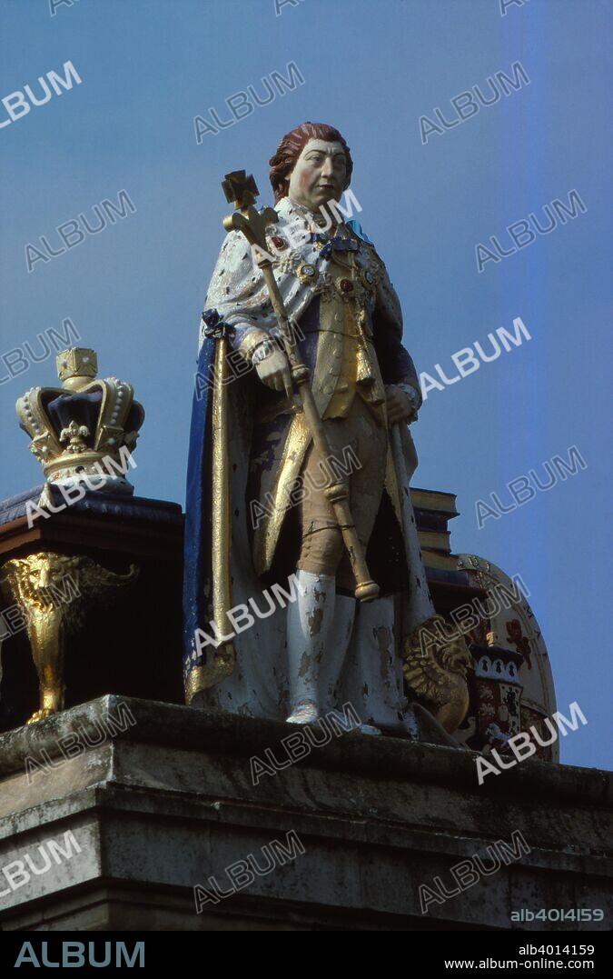 Statue of  King George III, Weymouth, Dorset, 20th century. The Kings Statue is a tribute statue to King George III (1738-1820), located in Weymouth, where buildings on the seafront are mostly of Georgian architecture dating from the period he was in power, (1760-1820). It is a Grade I listed monument. The King dressed in Garter robes, is holding a sceptre in his right hand.