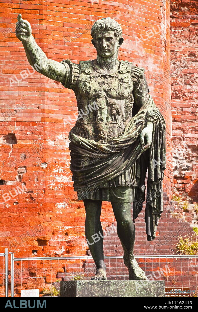 A statue of Caesar Augustus in front of Porta Palatina, Turin, Piedmont, Italy, Europe.