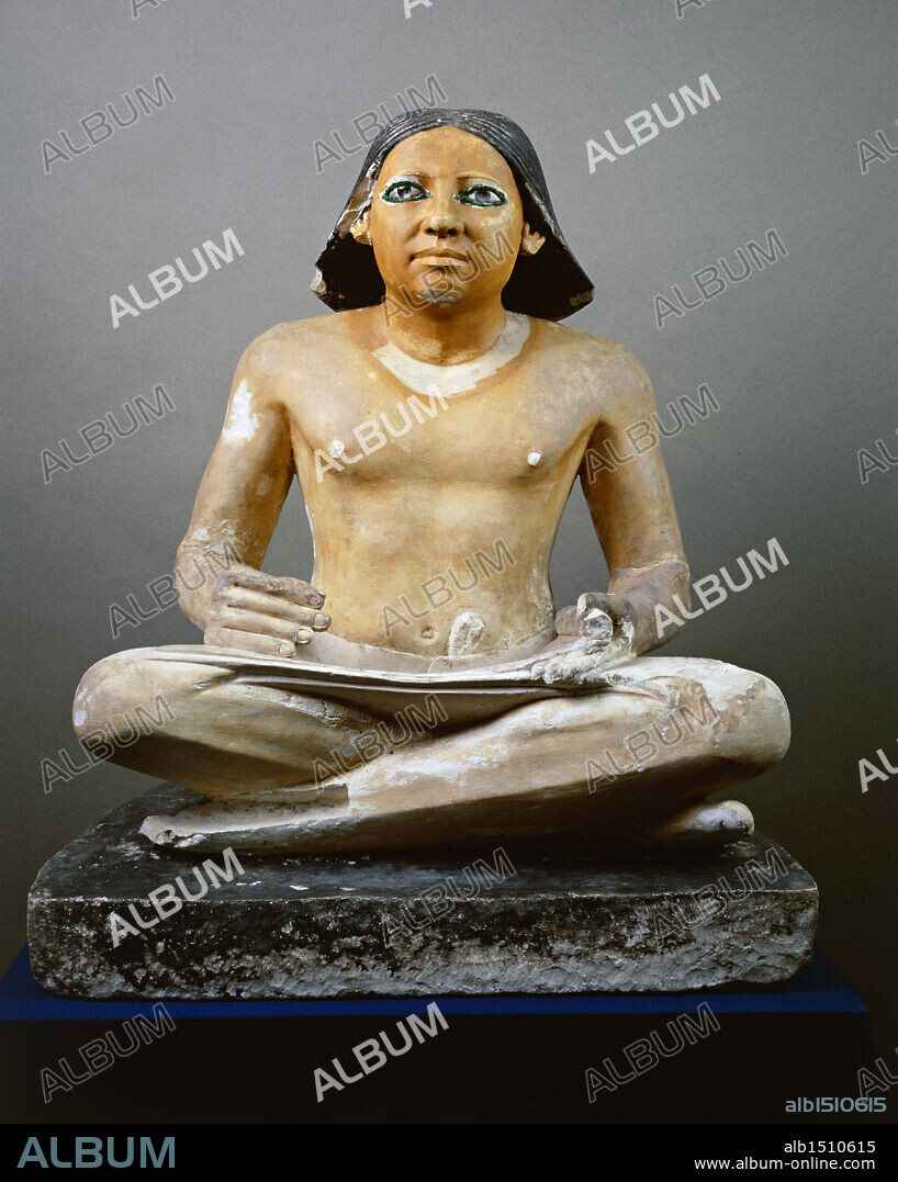 Egyptian civilization, Old Kingdom, Dynasty V. Statue of a seated scribe with papyrus, 2475 b.C. circa. Painted limestone. From Saqqara.