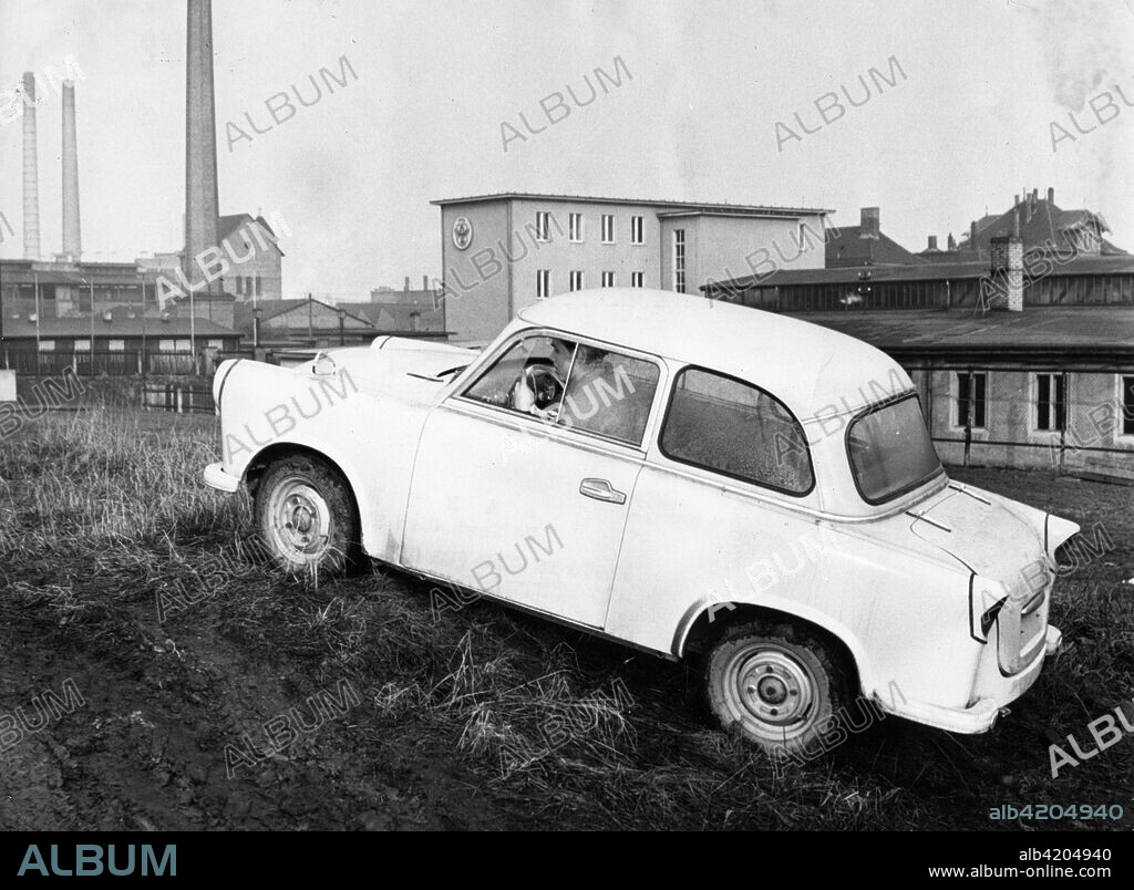 A Trabant 500 (P50) during a trial near the factory. This car has a 'Duroplast' body with tin-steel structure of low weight and resistance to corrosion. It has an 18 hp two-stroke air-cooled Otto Motor with 4 gears which uses 6 liters of fuel per 100 kilometers. Late 1950s.