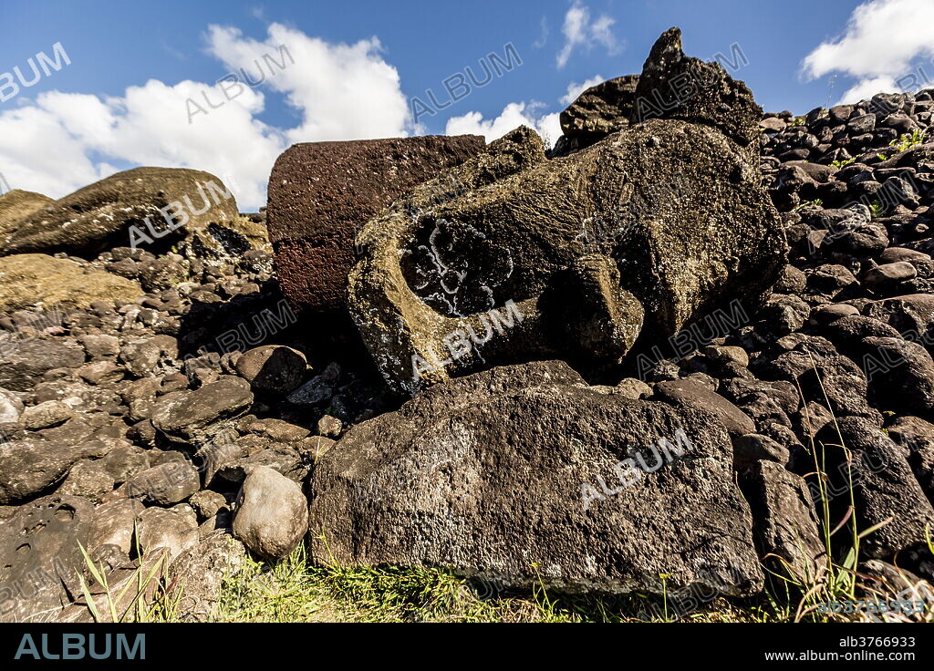 Fallen moai head and red scoria topknot at Ahu Akahanga on Easter Island (Isla de Pascua) (Rapa Nui), UNESCO World Heritage Site, Chile, South America.