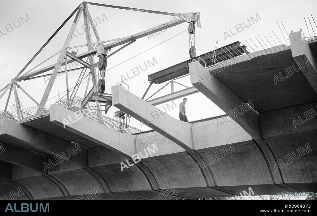 Hammersmith Flyover during construction, Hammersmith, London, 1961. The flyover was built  to carry the A4 Great West Road over the road junction at Hammersmith Broadway.