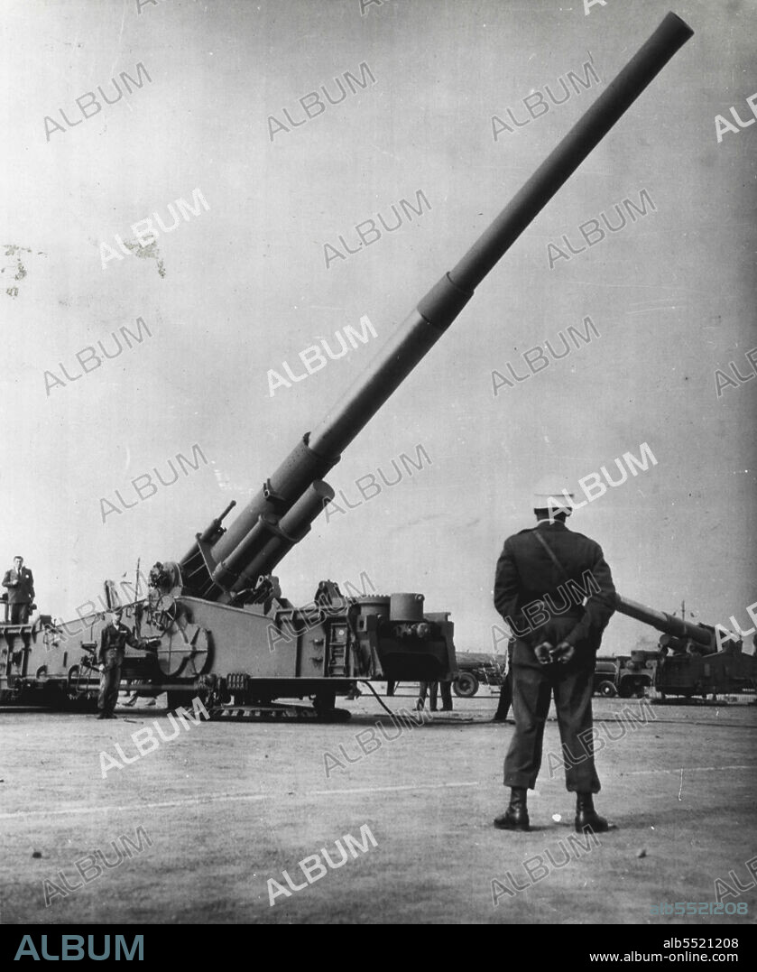 Atom Cannon In Germany -- The U.S. Army's 280mm atomic cannon points skyward at Mainz, Germany, Friday during the first public showing of the big weapons in Germany. The non-firing demonstration evoked accusations from East German communists that the Americans were placing the lives of Germans in "utmost danger." Six of the atomic guns, with a specially trained 900-man field artillery battalion, arrived earlier this month. October 25, 1953. (Photo by AP Wirephoto).