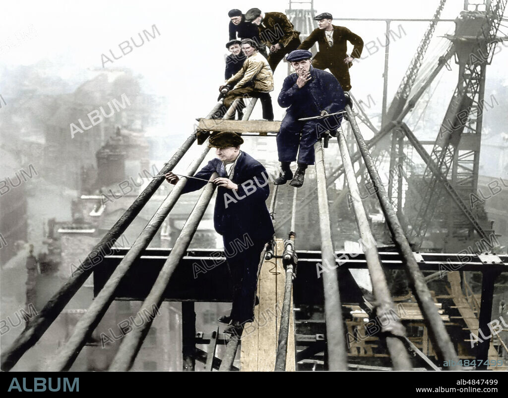 Postcard circa 1900, Victorian/Edwardian, social history. Workmen high on Tyne Bridge during construction in 1926; Newcastle Upon Tyne, Tyne and Wear, England.