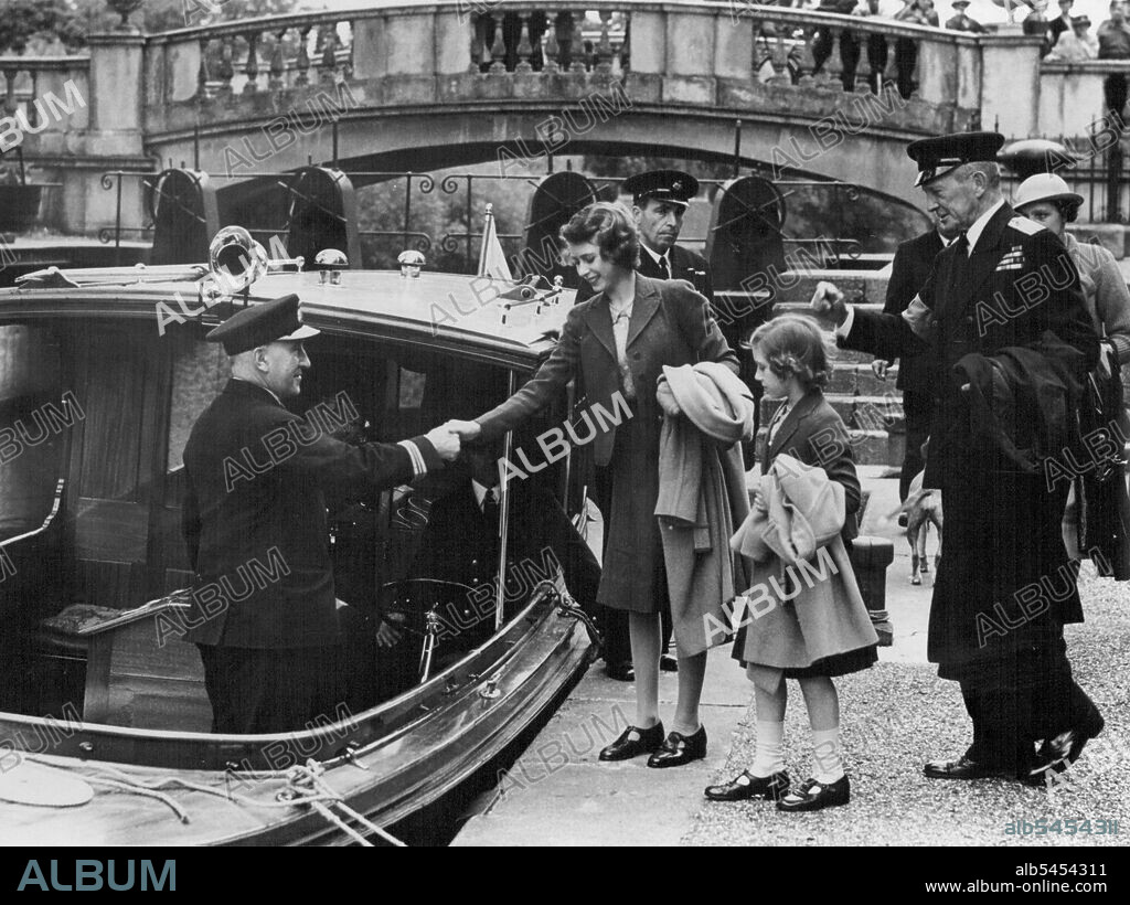 Princesses On The River : The Princesses boarding the launch. With them is Rear-Admiral Sir Basil Brooke. Princess Elizabeth and Princess Margaret Rose had a break from lessons today when they made a trip by launch on the Thames. October 24, 1940. (Photo by London News Agency Photos).