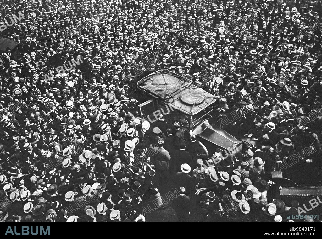 'Les Ovations de Paris; Au sortir de l'hotel Crillon, ou il a accompagné le general Pershing, le marechal Joffre remonte en automobile, au milieu des vivats de la foule', 1917. First World War: General Pershing is welcomed in Paris; on leaving the Hotel Crillon, where he had accompanied General Pershing, Marshal Joffre returns to his car, amid the cheers of the crowd. From "L'Album de la Guerre 1914-1919, Volume 2" [L'Illustration, Paris, 1924].