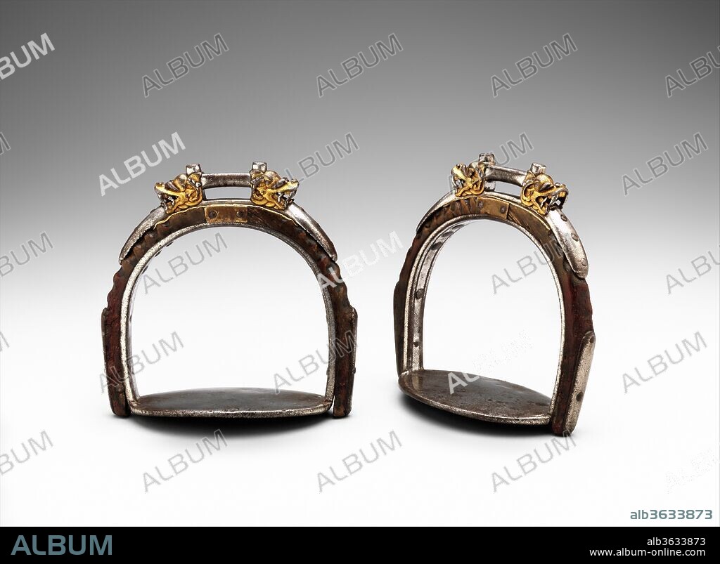 Pair of Stirrups. Culture: Tibetan or Mongolian. Dimensions: Stirrup (a); H. 5 7/8 in. (14.9 cm); W. 5 7/8 in. (14.9 cm); D. 3 1/4 in. (8.3 cm); Wt. 1 lb. 3.6 oz. (555.7 g); stirrup (b); H. 6 in. (15.2 cm); W. 6 in. (15.2 cm); D. 3 1/4 in. (8.3 cm); Wt. 1 lb. 2.5 oz. (524.5 g). Date: 15th-17th century.
The unusual, possibly unique, combination of horn and iron as well as the superior quality of the high-relief chiseling of the dragonheads, and the extensive use of gold and particularly silver damascening over their iron surfaces set these stirrups apart. The plainness of the tread plates, however, and the sturdy construction overall show that they were intended for rigorous use.