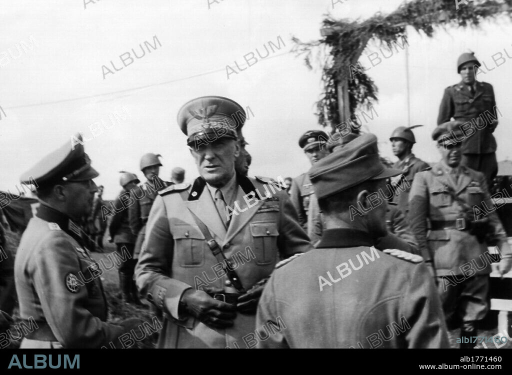 Rodolfo Graziani talks to Eugen Ott. While waiting for Benito Mussolini, Marshall Rodolfo Graziani is in discussion with the German general Eugen Ott, the inspector of the training groups. Munzingen, 17th July 1944.