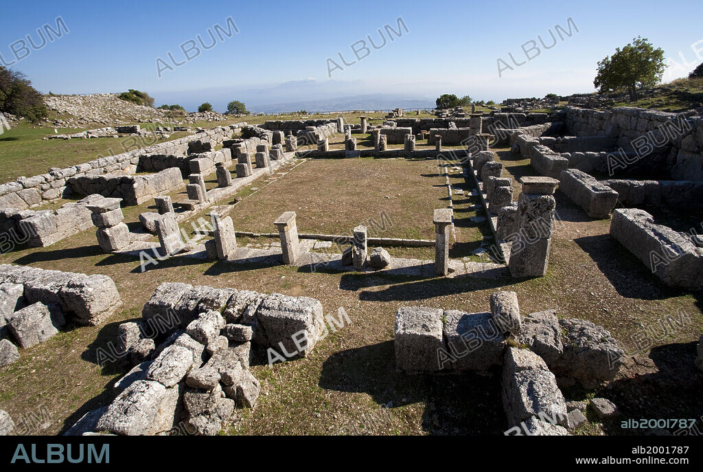 Kassope was founded at the beginning of the 4th century BC, possibly as a consolidation of smaller rural villages. It is a splendid example of a city based on the Hippodamian grid plan. The city walls enclose a grid plan of city blocks. The paved roads, often featuring drains for rainwater, were built in steps. The city features a vast agora, ruins of the bouleuterion, a katagogion (360-350 BC) and a theater (300-250 BC).