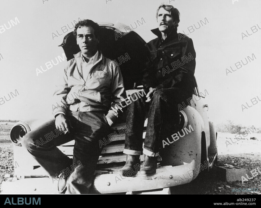 DEAN STOCKWELL and HARRY DEAN STANTON in PARIS, TEXAS, 1984, directed by WIM WENDERS. Copyright 20TH CENTURY FOX.