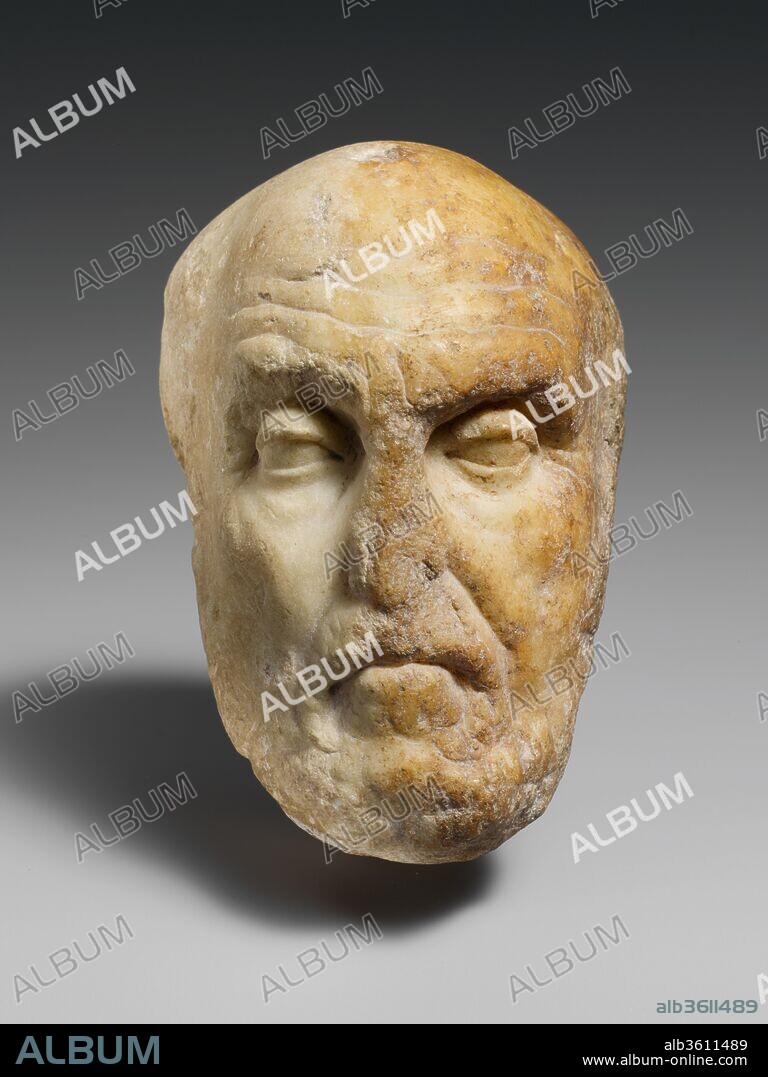 Marble portrait head of the philosopher Chrysippos. Culture: Roman. Dimensions: 5 1/2 in. (14 cm). Date: 1st century A.D..
Copy of a Greek statue of the late 3rd century B.C., probably by Euboulides
Chrysippos was one of the most important Stoic philosophers of the third century B.C. His writings helped establish Stoicism as a major philosophical movement. Stoicism held that human beings should be free from passion and calmly accept all occurrences as the unavoidable result of divine will. The term Stoic derives from the Greek word stoa, a type of colonnaded building in which the philosophers gathered.
It is clear from other copies of this type that Chrysippos was usually represented seated, as a fragile elderly man with his right hand outstretched as if in the midst of making a point. In a manner characteristic of most early Hellenistic art, the viewer would be drawn into the pictorial space and become, as it were, the philosopher's interlocutor. His winning intellect, eloquently conveyed in the features of this head, would have contrasted markedly with his frail old body, emphasizing that the power of the spirit triumphs over physical weakness.