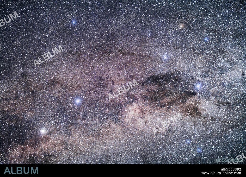 The Pointer Stars (Alpha and Beta Centauri, at left) pointing to the stars of the Southern Cross, Crux, at right. The Coal Sack, obvious as a dark patch in the Milky Way to the naked eye, here looks less obvious as it breaks up into streaks and bands of dark dust to the left of the Cross.