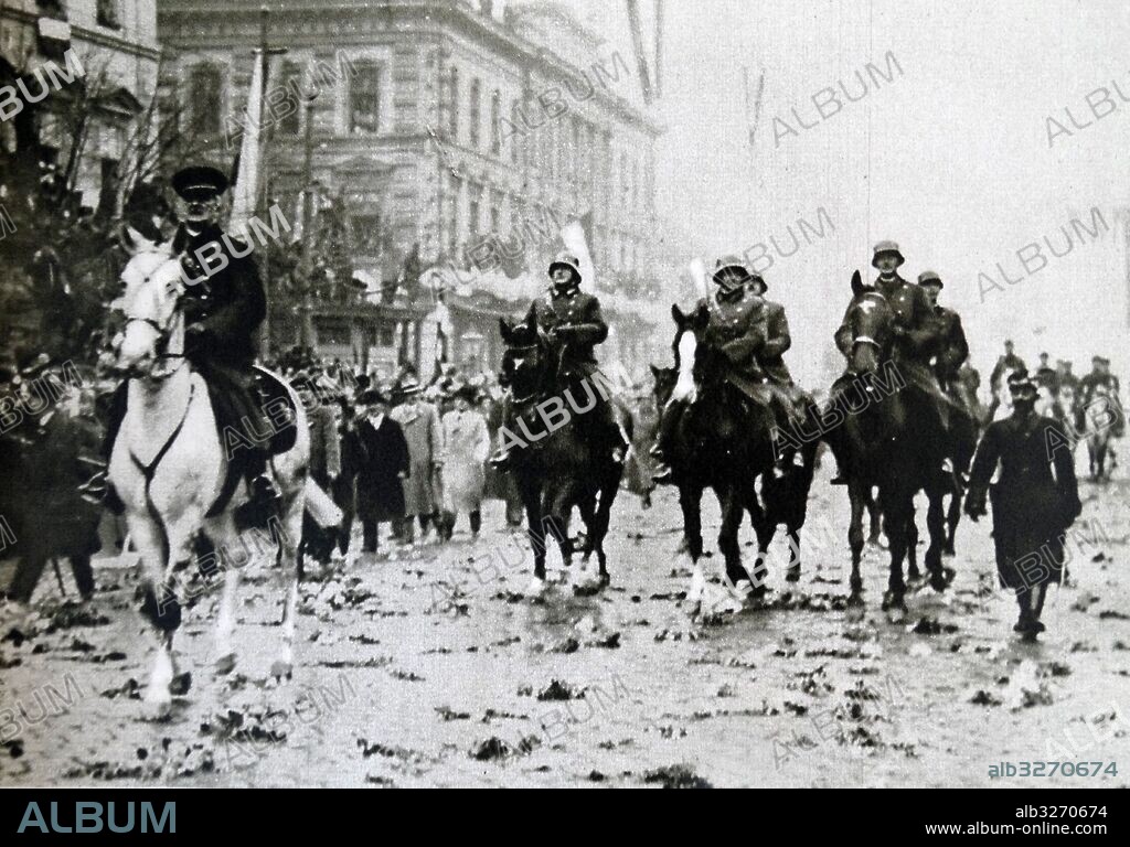 Photographic print of Miklos Horthy de Nagybanya (1868-1957) a Hungarian admiral and statesman, who served as Regent of the Kingdom of Hungary between World Wars I and II, riding horseback through streets. Dated 20th Century.