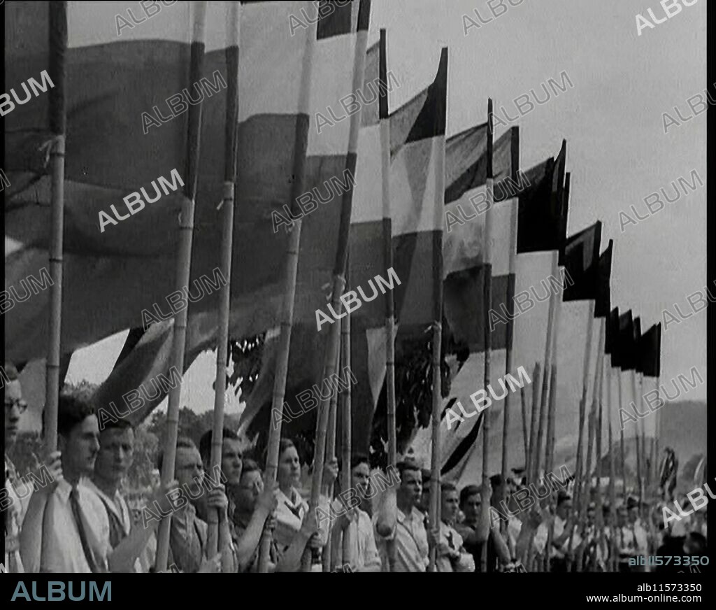 Hitler Youth Members Holding Flags, 1930s. From "Time To Remember -  The Powers That Were", 1930s (Reel 3); a documentary about various important figures of the 1930s.