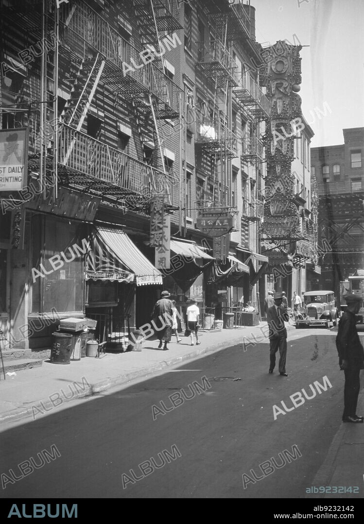 ARNOLD GENTHE. Chinatown, in San Francisco or New York City, between 1911 and 1942. Signs: 'barber shop; Kwong Loy Yuen; Som Mun Co.; Dancing; Oriental'.