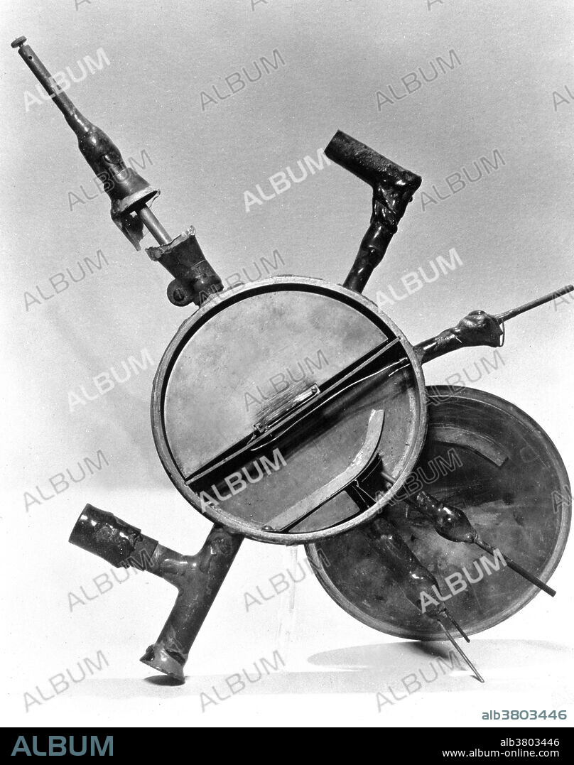 The first working model of Ernest Lawrence's cyclotron, constructed of glass, sealing wax and bronze and measuring 5 inches in diameter. Ernest Orlando Lawrence (August 8, 1901 - August 27, 1958) was an American physicist and Nobel Laureate, known for his invention, utilization, and improvement of the cyclotron atom-smasher beginning in 1929, based on his studies of the works of Rolf Wideroe, and his later work in uranium-isotope separation for the Manhattan Project. Lawrence had a long career at the University of California, Berkeley, where he became a Professor of Physics. In 1939, Lawrence was awarded the Nobel Prize in Physics for his work in inventing the cyclotron and developing its applications. After the war, Lawrence campaigned extensively for government sponsorship of large scientific programs. Lawrence was a forceful advocate of "Big Science" with its requirements for big machines and big money. He'd died in 1958 at the age of 57. After his death, the Regents of the University of California voted to rename two of the university's nuclear research sites after Lawrence: the Lawrence Livermore and Lawrence Berkeley Laboratories. Chemical element number 103, discovered at LBNL in 1961, is named "lawrencium" in his honor.