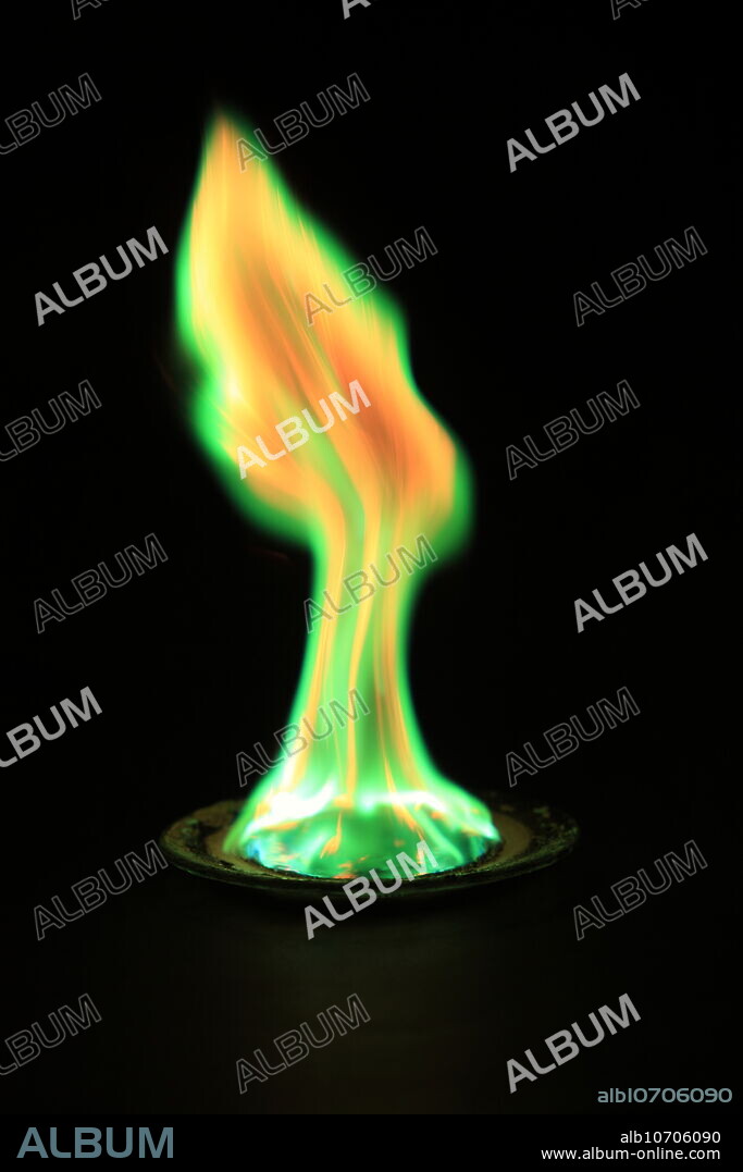 Copper(II) chloride (CuCl2) emits a green-blue glow in a flame test. In this experiment the copper chloride is placed in a watch glass and saturated with ethanol. The burning ethanol heats the copper to show the characteristic green flame.