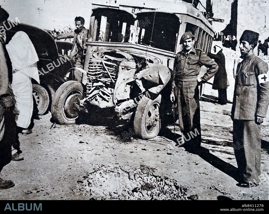 A wrecked Arab bus after an explosion at the Damascus Gate in Jerusalem in 1947 during the 1936-1939 Arab revolt in Palestine against the Mandatory Palestine. Two British constables and 11 Arabs were killed and 32 Arabs wounded when Irgun members threw a bomb from a taxi at Jerusalem's Damascus Gate.