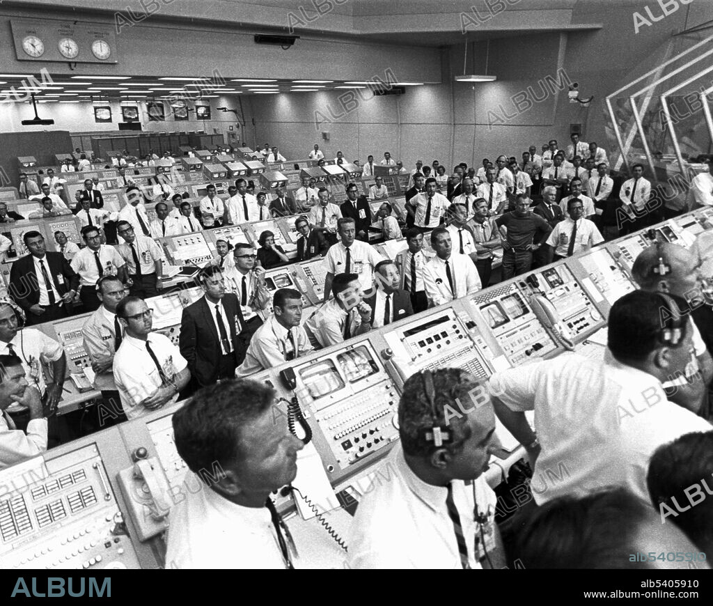 Inside the Launch Control Center, personnel watch as the Saturn V rocket carrying the Apollo 11 astronauts lifts off the launch pad on July 16, 1969. The Launch Control Center (LCC) is a four-story building at NASA's Kennedy Space Center on Merritt Island, Florida, used to manage launches of spacecraft from Kennedy Space Center Launch Complex 39. The LCC handles all American space flights with human crews. Attached to the southeast corner of the Vehicle Assembly Building, the LCC contains offices; telemetry, tracking, and instrumentation equipment; the automated Launch Processing System; and four firing rooms. LCC has conducted launches since the unmanned Apollo 4 launch in 1967. LCC's first launch with a human crew was Apollo 8 on December 21, 1968. NASA's Space Shuttle program also used LCC. NASA has renovated the center for the upcoming Space Launch System (SLS) missions, which are scheduled to begin in 2020 with Exploration Mission-1.
