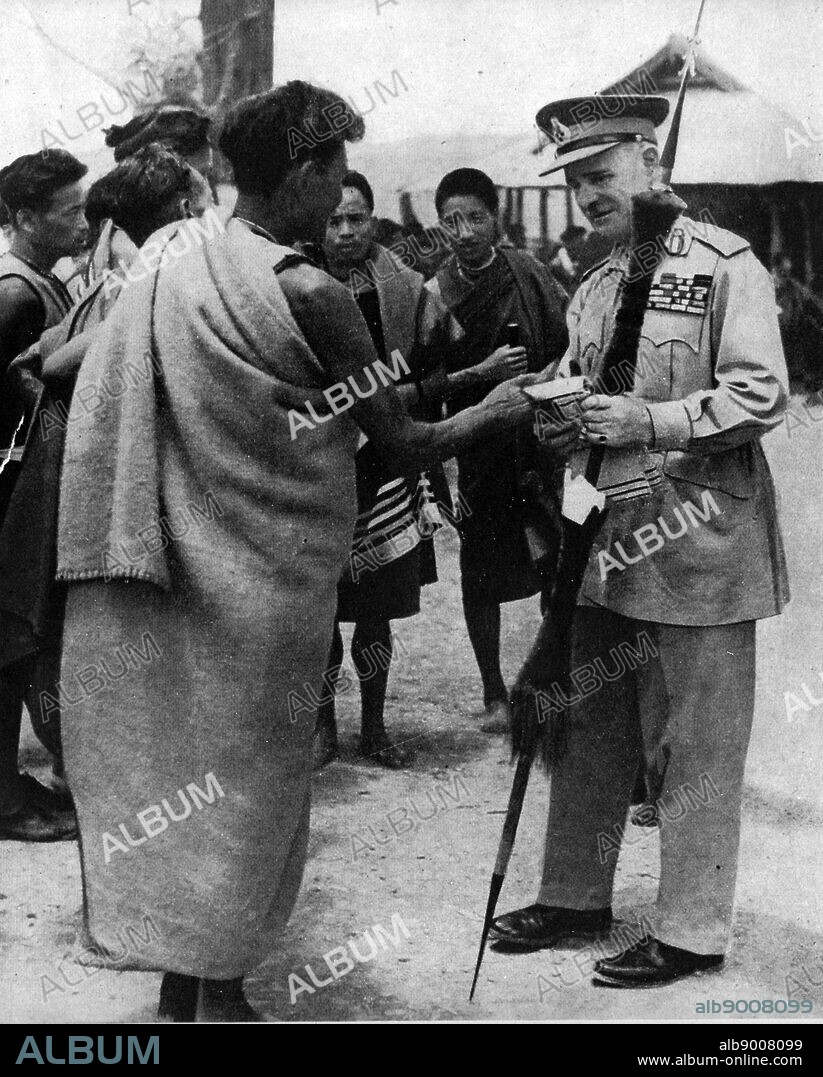 On August 10 1944 it was announced that Field-Marshal Wavell, Viceroy of India, recently toured the Manipur front. Lord Wavell thanked the Naga Hill men for their help against the Japanese and is here seen accepting gifts from them at Kohima.