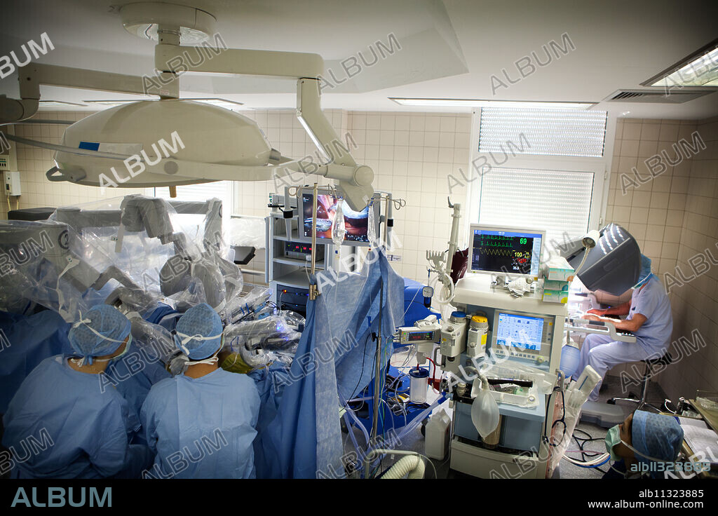 Surgeon performing a prostatectomy, removal of the prostate, using a robot surgeon.