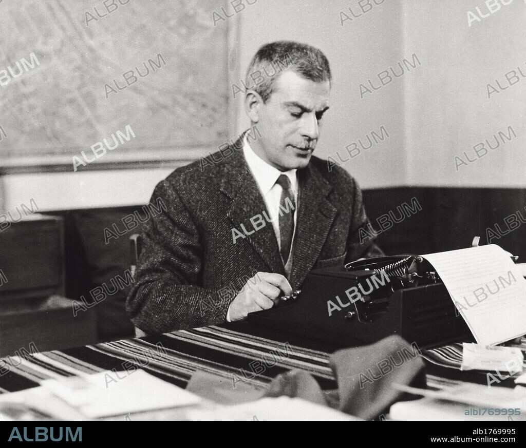 Highbrow Elio Vittorini. Novelist Elio Vittorini at a typewriter. Milan, February 1955.