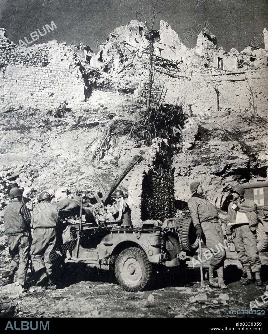 Wounded soldiers are transferred from jeeps to ambulances at the first aid station at a destructed San Pietro, Italy, during World War II. The Battle of San Pietro Infine, commonly referred to as the Battle of San Pietro, was a major engagement in the 1943 Italian Campaign of World War II involving Allied forces against heavily fortified positions of the German Winter Line in and around the town of San Pietro Infine, Italy.
