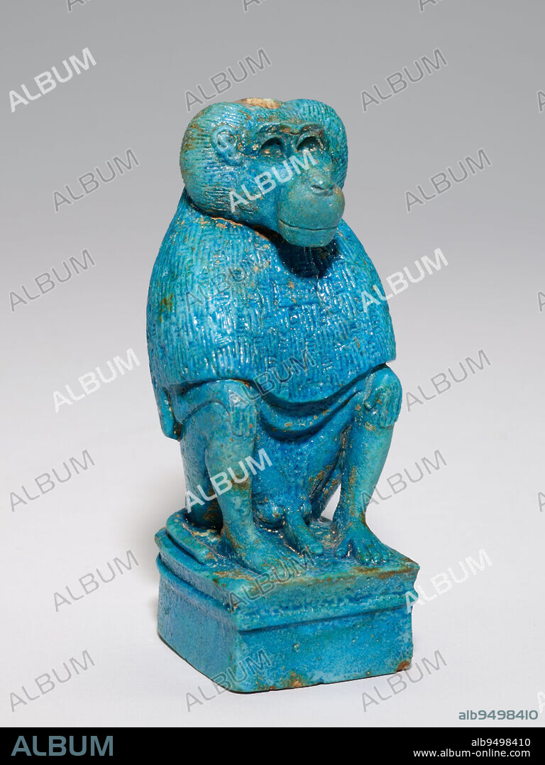 Baboon (Moon God Thoth), 7th - 6th century BCE, 6 1/4 × 2 3/4 × 3 1/4 in. (15.88 × 6.99 × 8.26 cm), Faience, Egypt, 7th - 6th century BCE, Monkeys were kept as costly pets by the elite in ancient Egypt, yet their regal appearance and imposing presence also made them useful representations of gods in the Egyptian religion. The baboon was usually associated with Thoth, one of the moon gods. This animal has a hole in the crown that once held a lunar disk sitting on top of a crescent moon, an attribute of Thoth. For a 2,600-year-old artwork it is in remarkable condition, and though the animal is small in size, its posture and expression command authority.