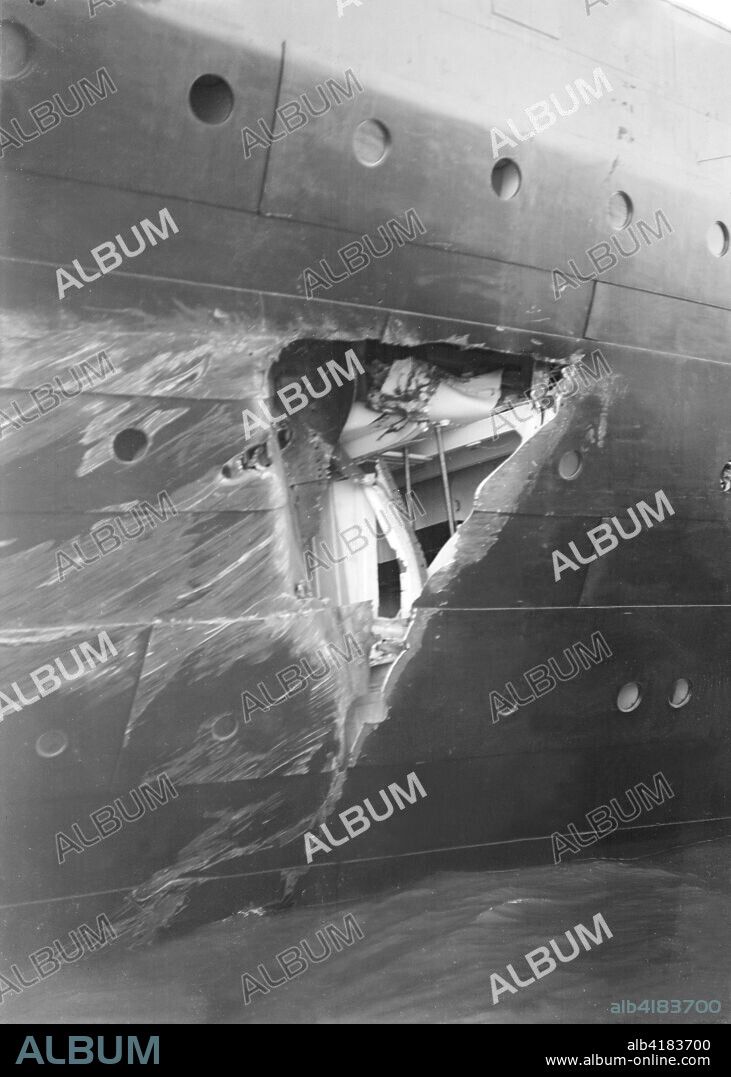 Hole torn in the hull of 'RMS Olympic' after the collision with 'HMS Hawke' in the Solent, 20th September 1911. The collision took place as Olympic and Hawke were running parallel to each other through the Solent. As Olympic turned to starboard, the wide radius of her turn took the commander of Hawke by surprise, and he was unable to take sufficient avoiding action. Hawke's bow, collided with Olympic's starboard side near the stern, tearing two large holes in Olympic's hull, above and below the waterline which resulted in the flooding of two of her watertight compartments and a twisted propeller shaft. At a subsequent inquiry the Royal Navy blamed Olympic for the incident, alleging that her large displacement generated a suction that pulled Hawke into her side. The Olympic was the lead ship of the White Star Line's trio of Olympic-class liners which also included Titanic and Britannic,.